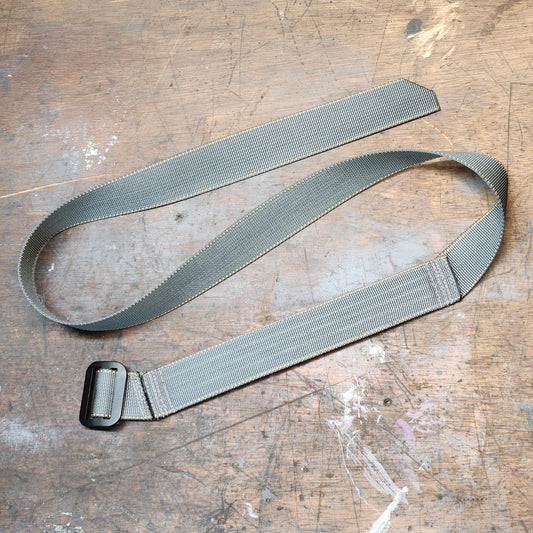 Old Machine Craft (OMC) gray Advanced AIWB CCW belt for appendix carry flat on table.